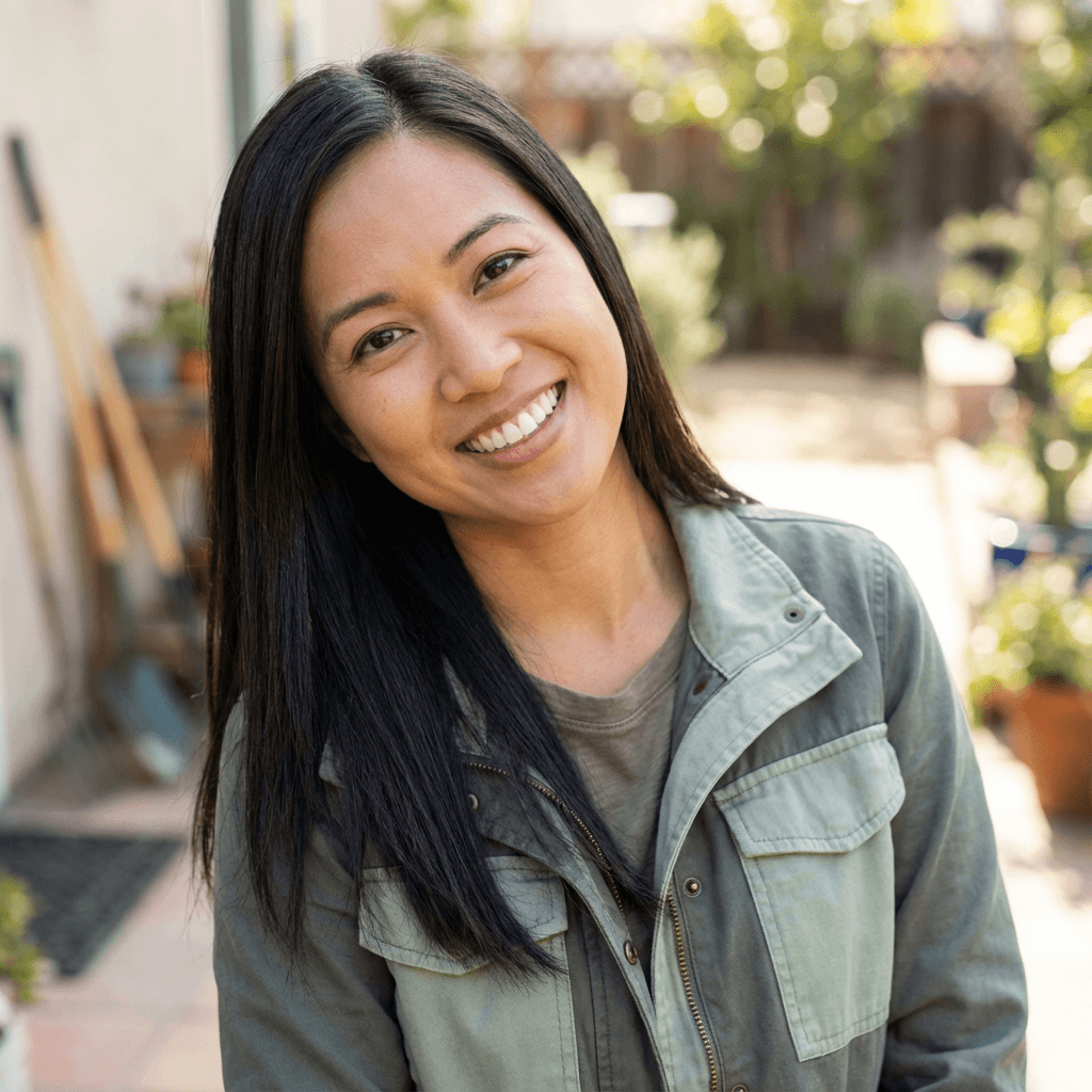 Female cleaning company owner in her early 40s with a welcoming smile